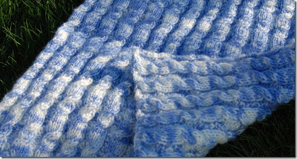 hand or machine knit reversible cable baby blanket made popular by lily chin