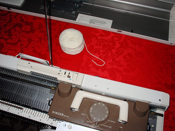how to thread a knitting machine step 1 place yarn behind tension unit