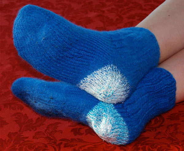 Felted blue worsted weight wool socks from a boy scout winter camping trip