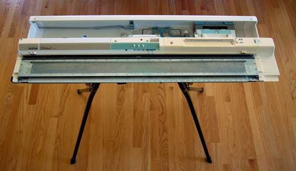 Knitting machine stand with Brother electronic attached