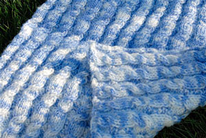reversible cable machine knit baby blanket